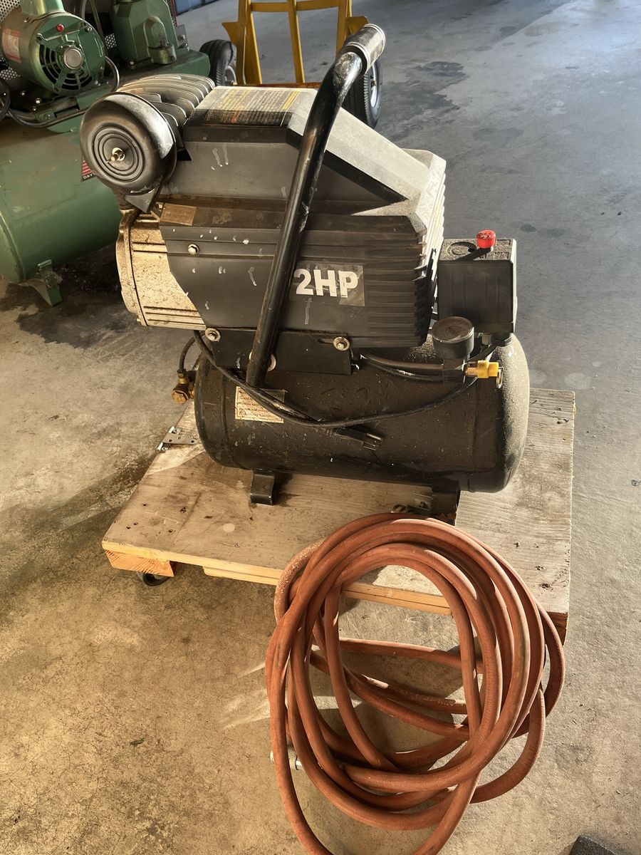 Central Pneumatic 2HP 2.64 Gallon Air Compressor, includes a pneumatic impact wrench, 2 add’! coiled air hoses, & 2 blow guns.