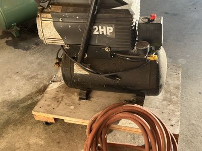 Central Pneumatic 2HP 2.64 Gallon Air Compressor, includes a pneumatic impact wrench, 2 add’! coiled air hoses, & 2 blow guns.