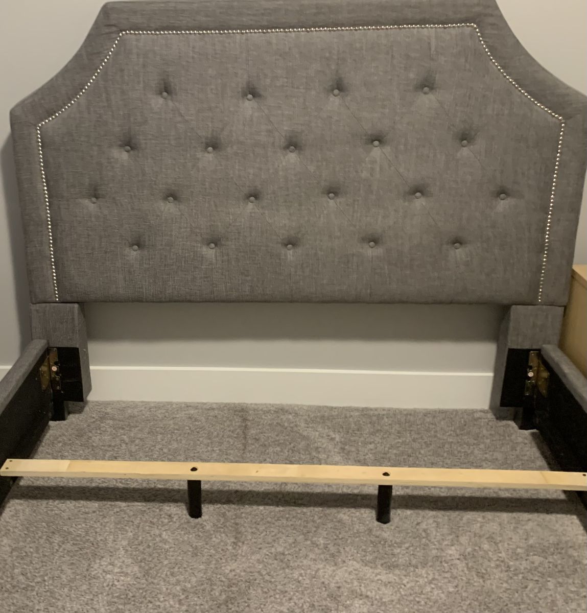 Queen bed, grey linen, chrome hammered nailhead tufted headboard