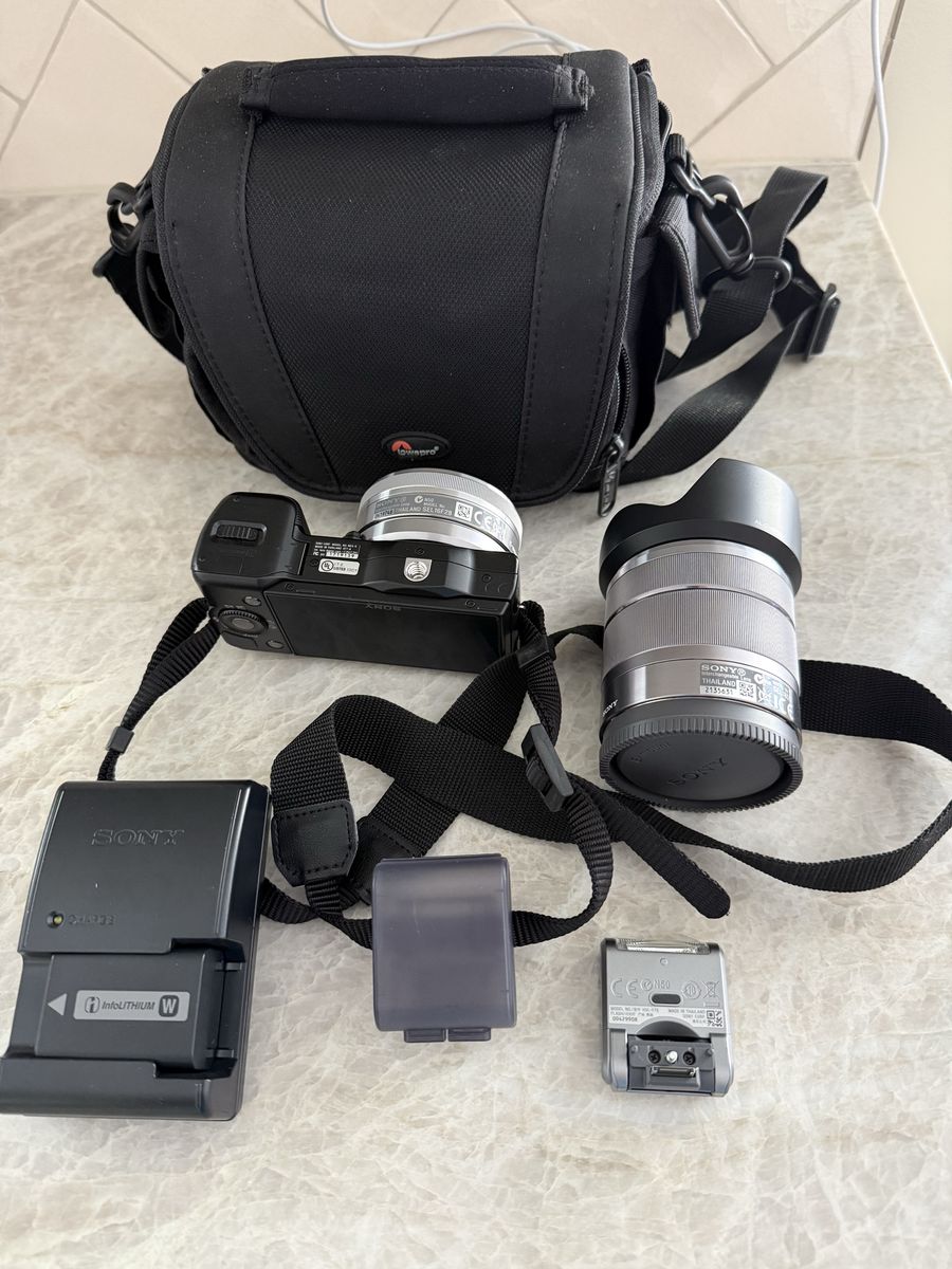 Sony Nex-5 Mirrorless Camera with 2 Lenses, Battery Charger, Flash, and Carry Bag