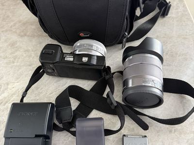 Sony Nex-5 Mirrorless Camera with 2 Lenses, Battery Charger, Flash, and Carry Bag