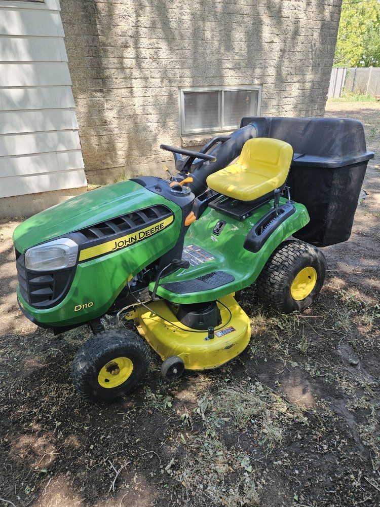John Deere D110 Riding Lawn Mower with Rear Bagger Attachment