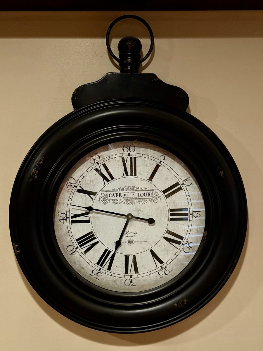 Wall clock with black distressed look frame