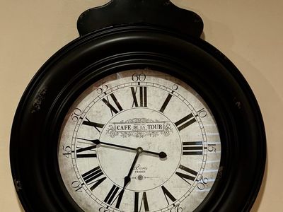 Wall clock with black distressed look frame
