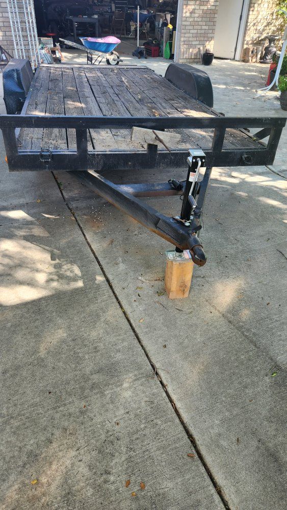17' flat bed double axle trailer with ramps.