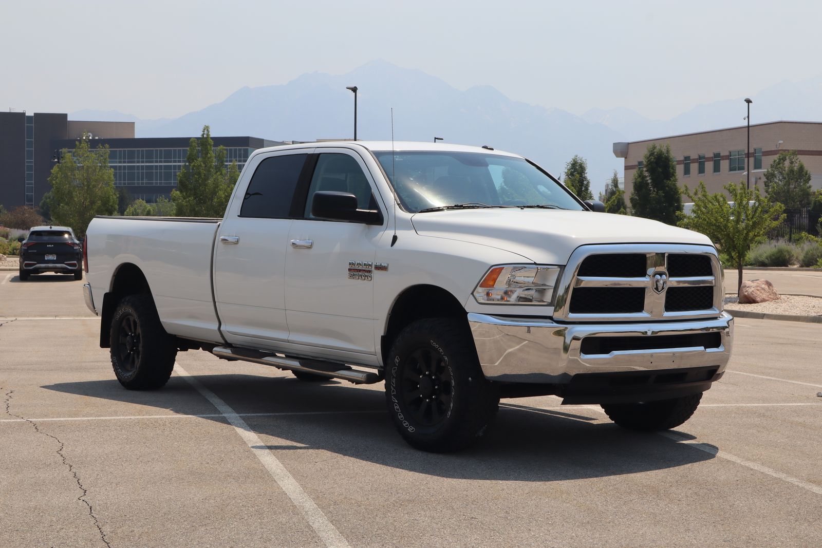 2015 RAM 2500 SLT — rebuilt & branded title, 27% below market