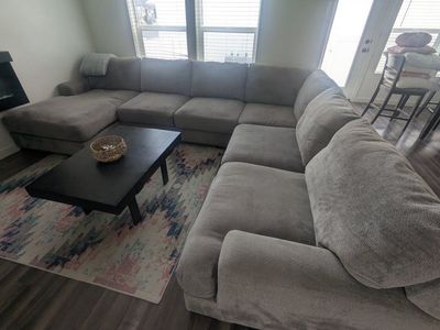 Large Gray U-Shaped Sectional Sofa.