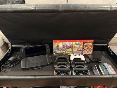 Nintendo Switch 2 Lite Console Bundle with 4 Games, Pro Controllers & Steering Wheels - Excellent Condition