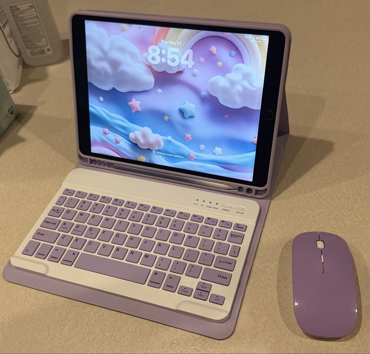 iPad Air (3rd Generation) with lavender case, rechargeable wireless keyboard, mouse, and Apple Pen.