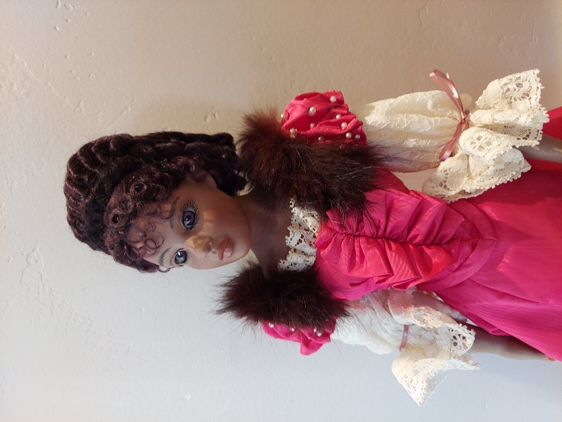 Porcelain Doll. Beautiful pink dress.