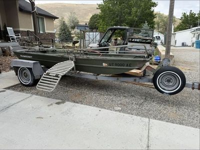 16’ Alumacraft Duck Boat, Motor, and Trailer