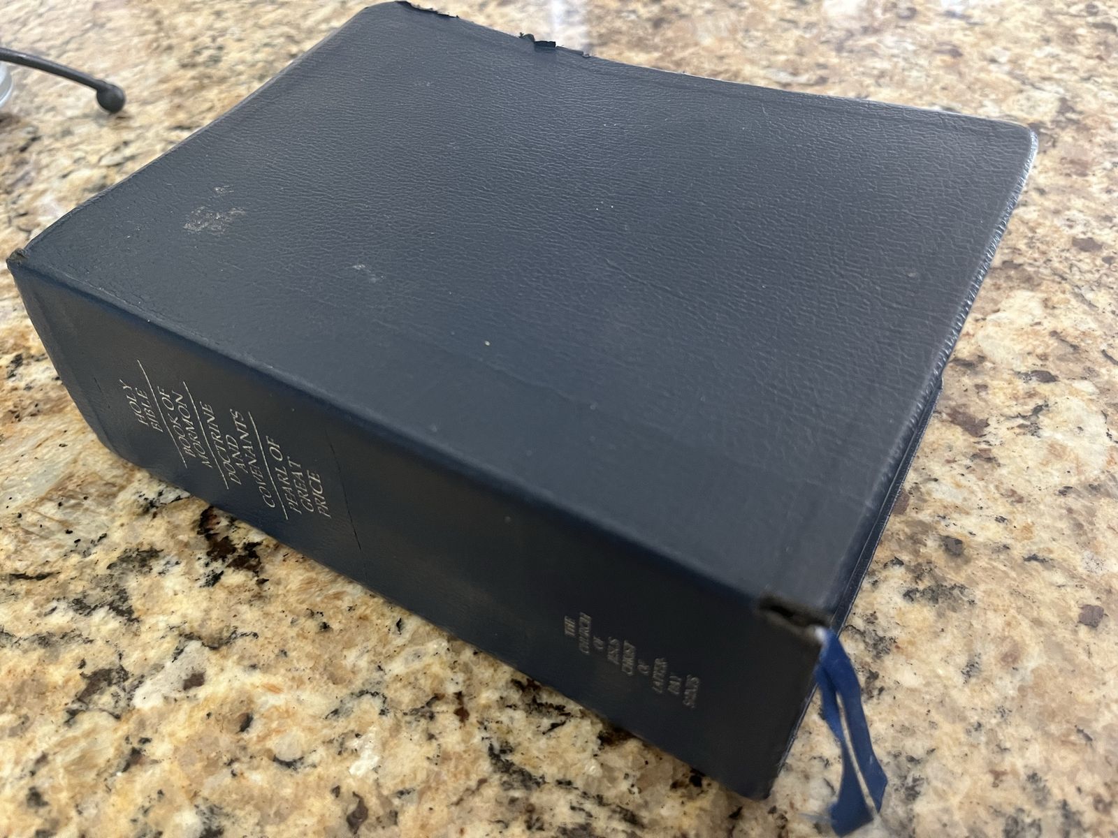 Dark  blue Lds, quad scriptures, 7 1/2 x 5 1/2" no name on cover with tabs probably 40 to 45 pages that have markings are under