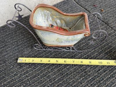 Decorative Ceramic Sleigh on Metal Stand with Holiday Figurine