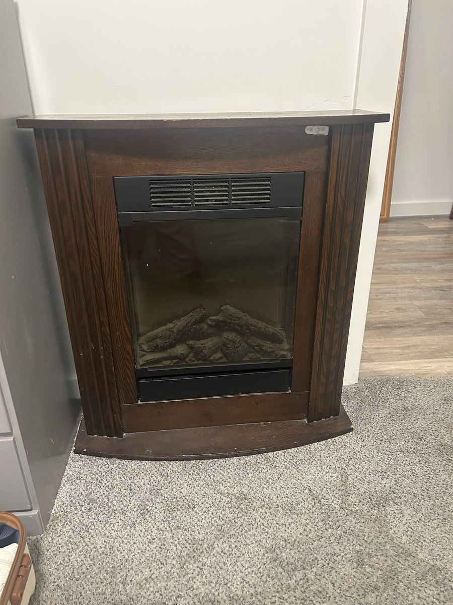 Electric Fireplace with Dark Wood Mantel Surround