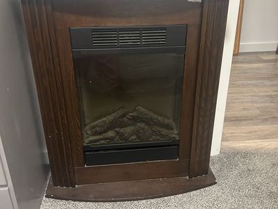 Electric Fireplace with Dark Wood Mantel Surround