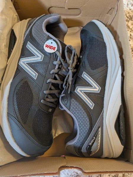 brand new New Balance size 14 shoes.