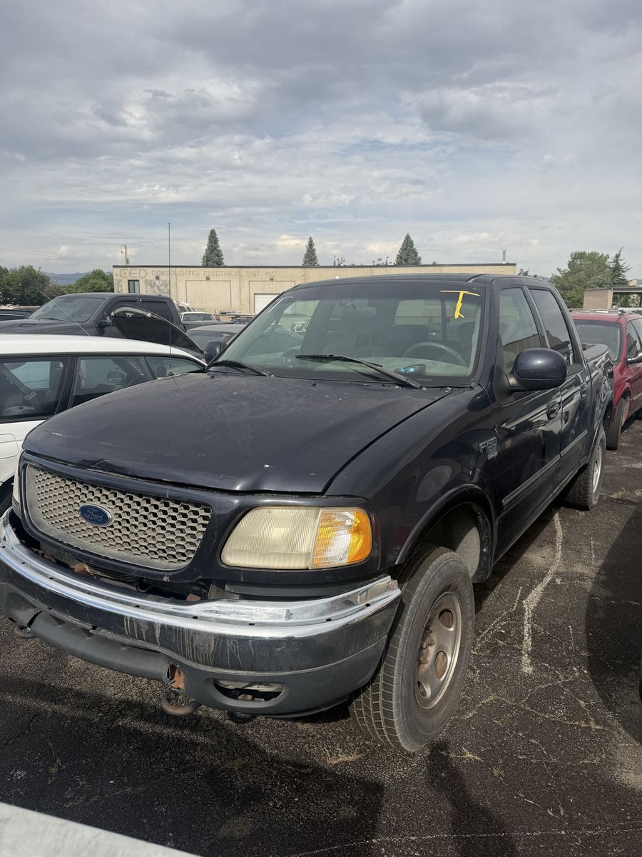 3 Ford F150 trucks