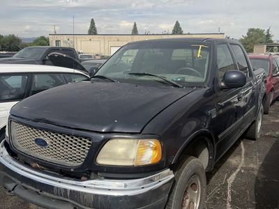 3 Ford F150 trucks