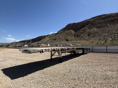 2016 Retinour 4-Axle Flatbed Trailer – Lift Axles – Aluminum Wheels