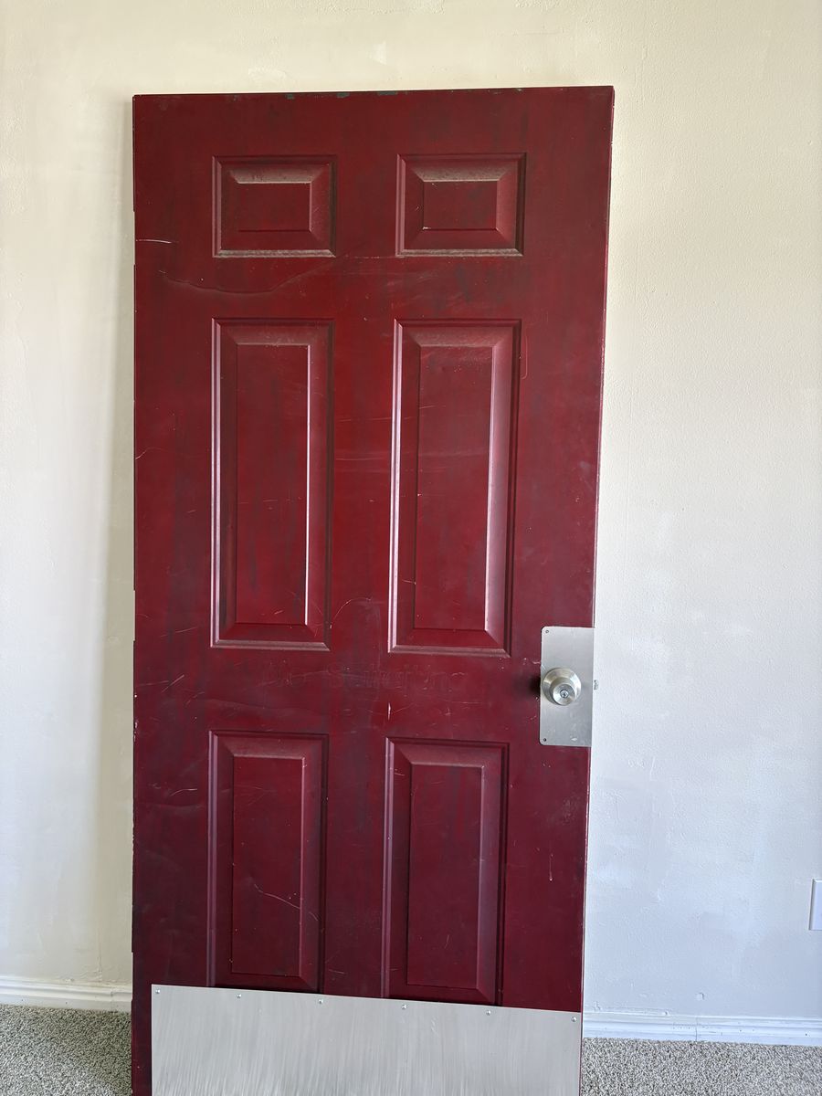 Exterior Front Door with door knob and key.  80x36