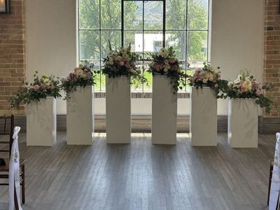6 White Wedding Pillars for Rent-$125 per day.