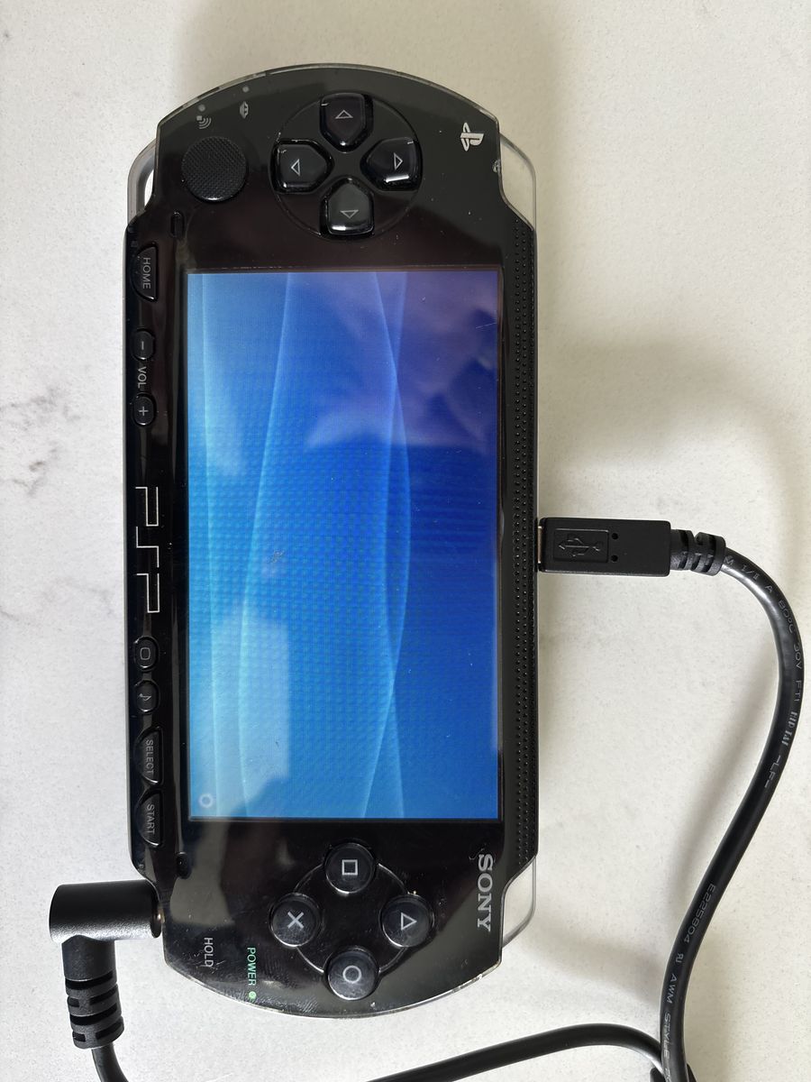 Sony PSP Bundle – Console, 16 Games & Movies, Chargers, Cases
