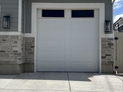 9' x 9' Sectional White Garage Door with Top Windows, Tracks, and Opener Motor Included