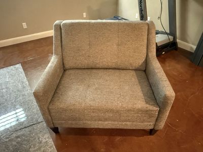 Grey upholstered armchair