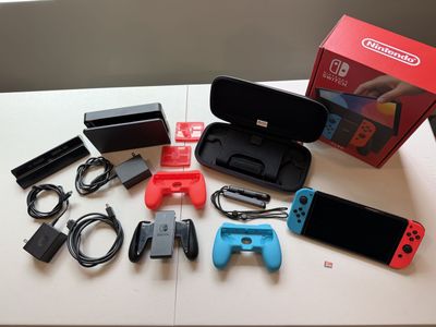 Nintendo Switch OLED w/ Red/Blue Joy-Cons, 2 Docks, Controller holders, Case & 400GB MicroSD