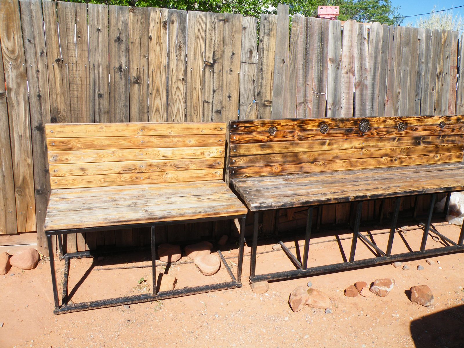 Two metal framed wood benches