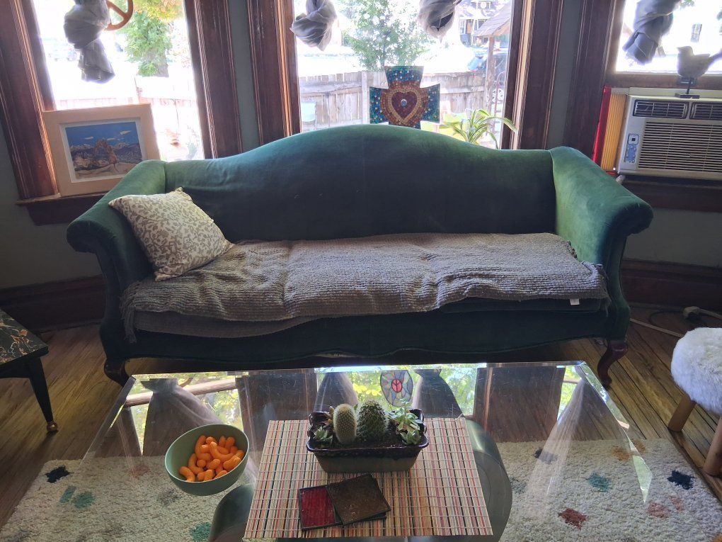 vintage couch with green chair.
