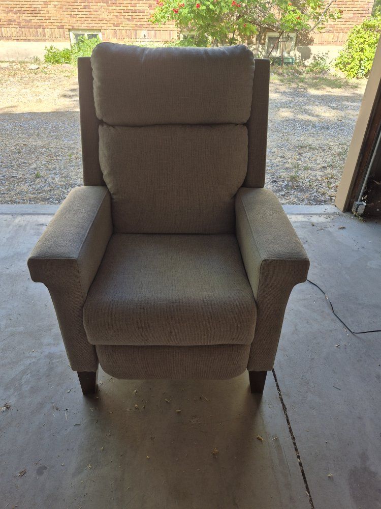 Power recliner chair with power headrest.