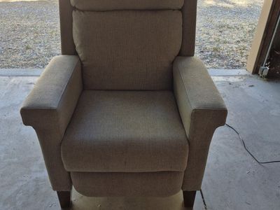 Power recliner chair with power headrest.