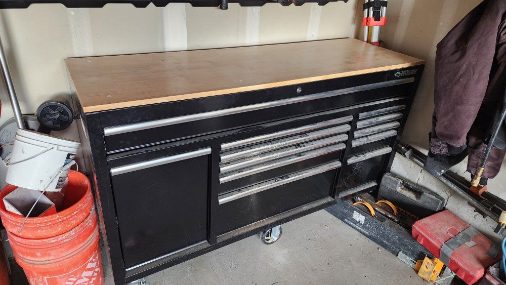 Husky 62" black mobile workbench w/ solid wood top & side power strip