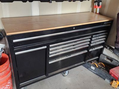 Husky 62" black mobile workbench w/ solid wood top & side power strip