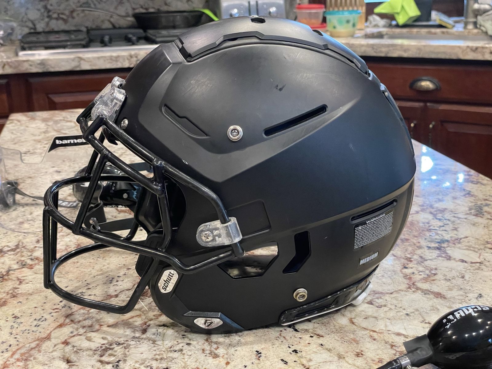 Schutt F7 LX1 Youth Football Helmet, Matte Black, Size Medium, with Faceguard, Visor, and SportStar chin strap