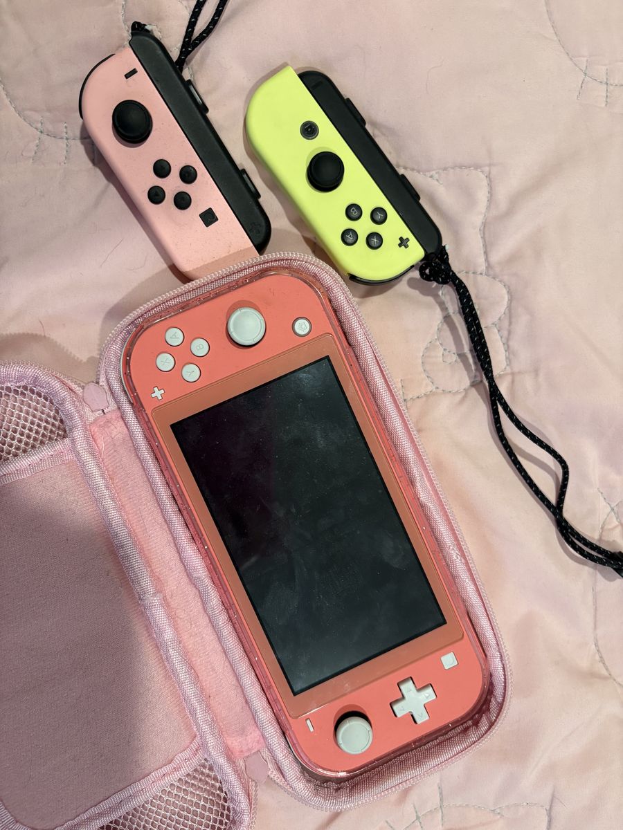 Nintendo Switch Lite with charger & extra controllers