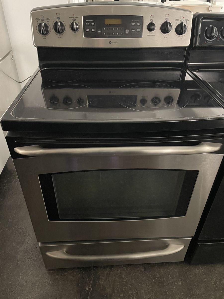 GE Stainless Range with 5 Burners, Comes With Pedestals and a 30 Day Warranty!
