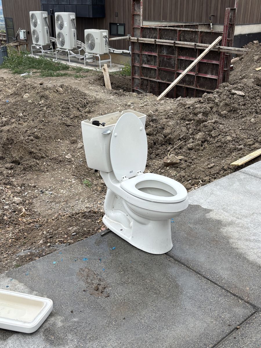 2 Toilets. American Standard and Gerber