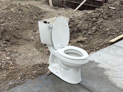 2 Toilets. American Standard and Gerber