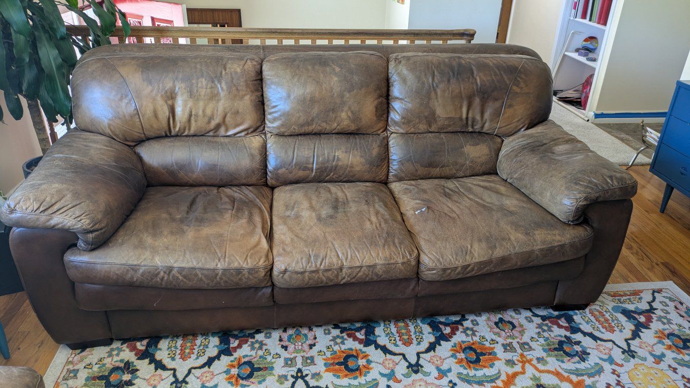 brown leather couch and loveseat