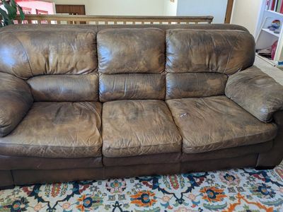 brown leather couch and loveseat
