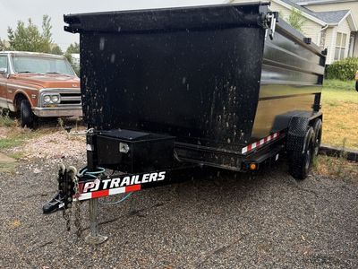 7x14 dump trailer for rent with 4ft walls