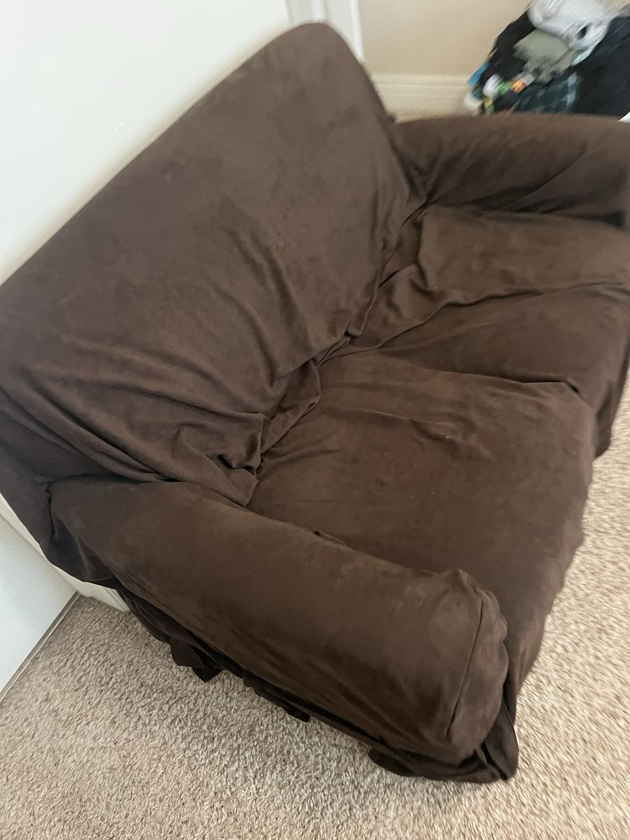 small couch with dark brown cover, covers in good shape couch looks like that black Fake leather not the greatest shape, perfect