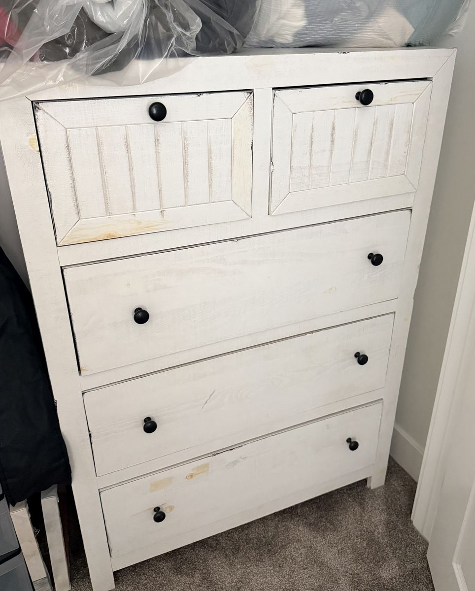 White Distressed Wooden Dresser with 5 Drawers and Black Knobs