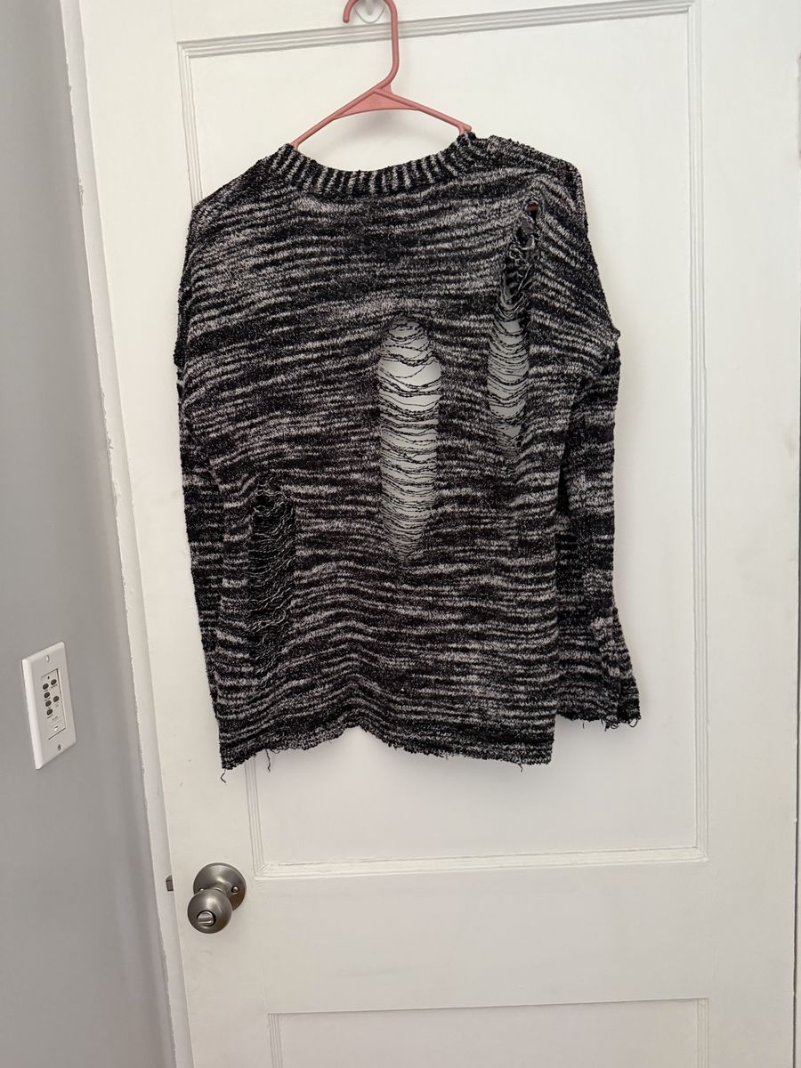 Light weight sweater looks shredded