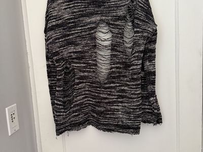 Light weight sweater looks shredded