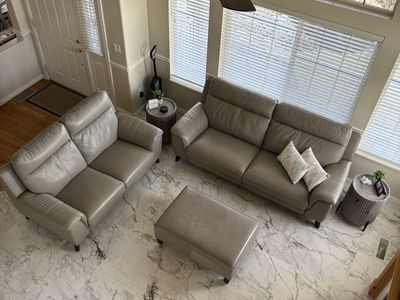 Living Spaces Family Room Furniture Matching Leather Reclining Sofa, Reclining Loveseat, Ottoman with Storage, & End Tables