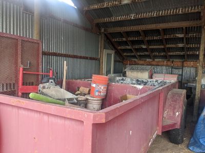 Curbing trailer including mixer, curbing machine and trencher.