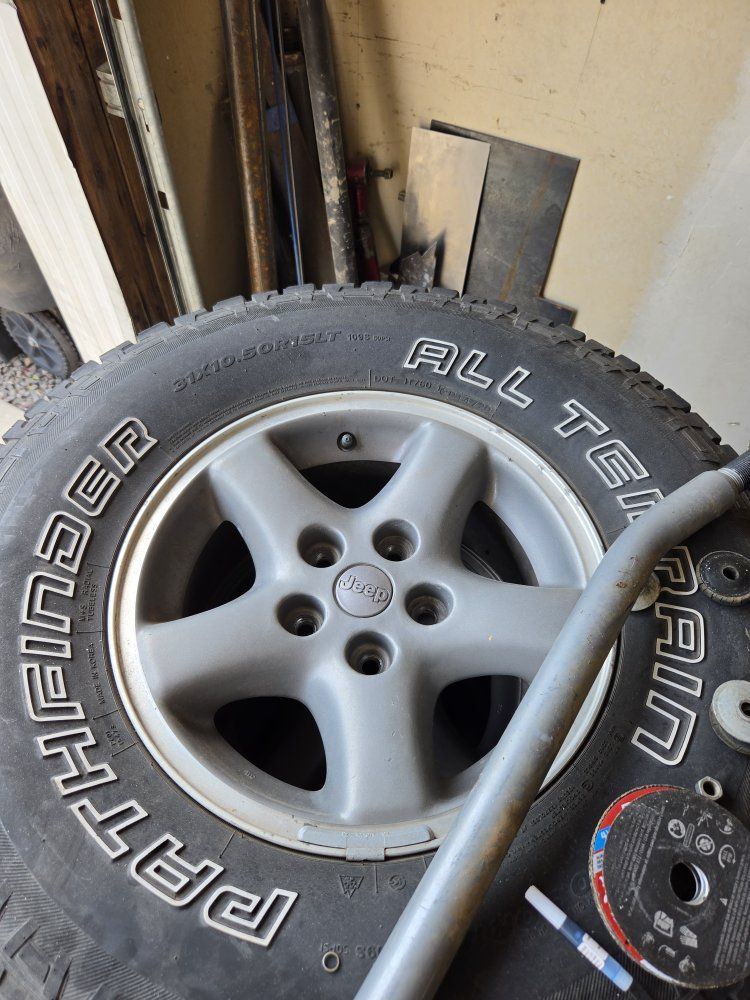 Set of 4 Pathfinder All Terrain Tires 31x10.50R15LT on Jeep 5-Spoke Alloy Wheels